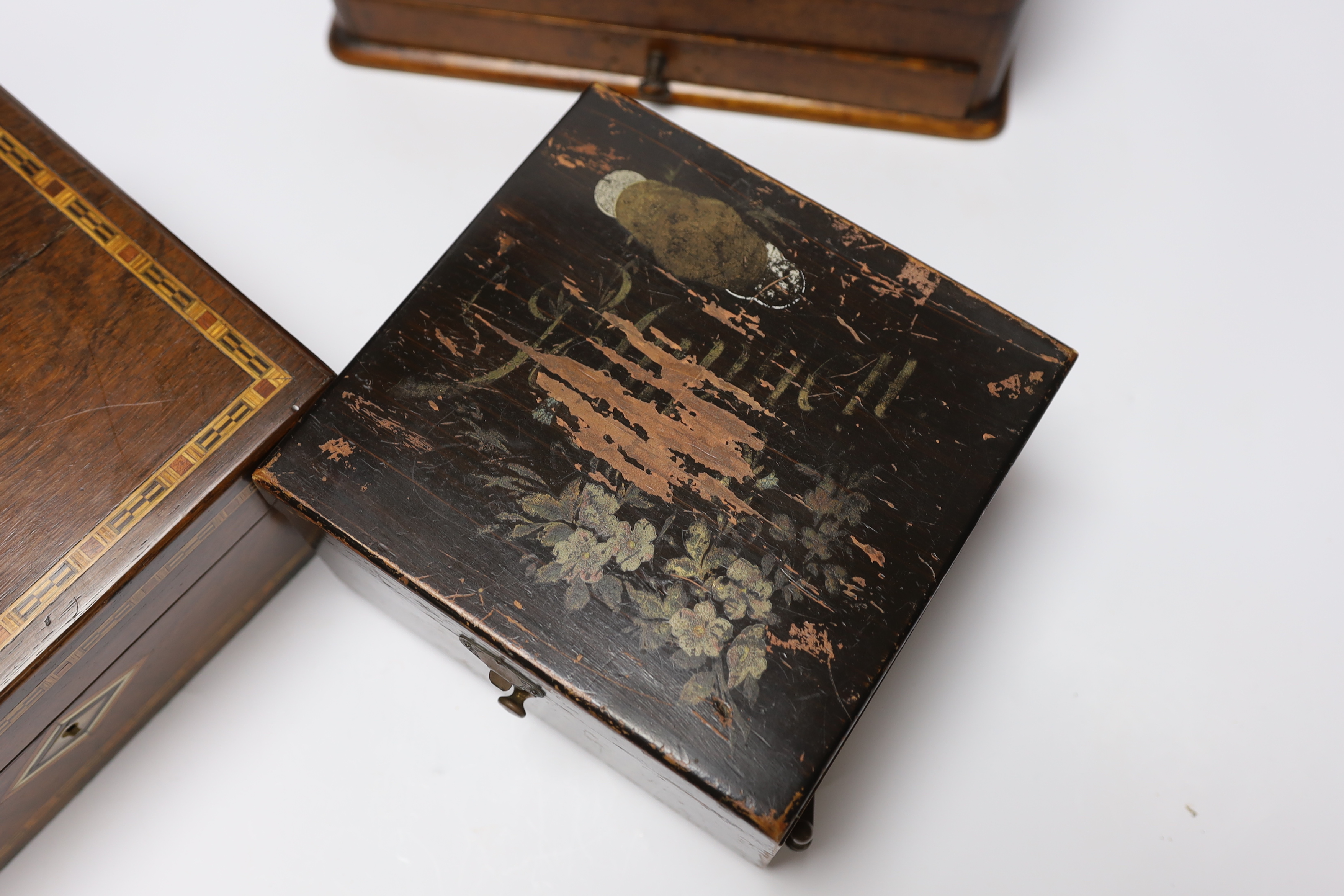 Three boxes; a miniature Polyphon, a stationery box and an inlaid jewellery box, stationery box 26cm high, 32cm wide